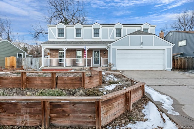 view of front of property with a garage and a porch