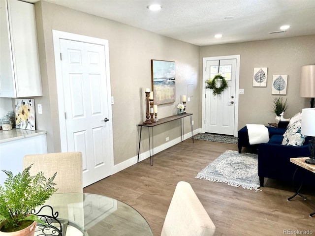 entryway with light hardwood / wood-style floors