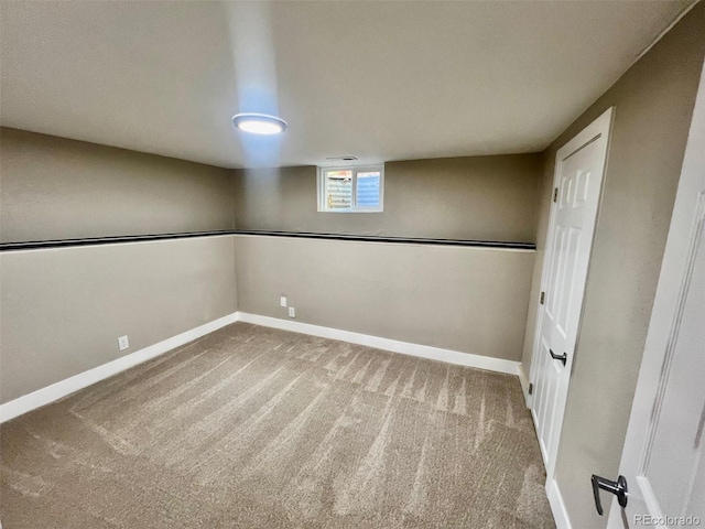 basement featuring carpet flooring