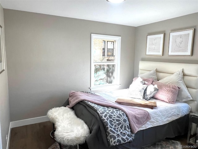 bedroom with hardwood / wood-style flooring