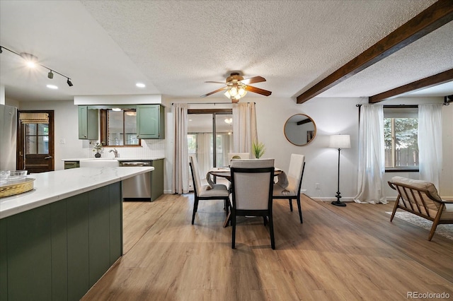 2130 Squires St, Longmont, CO 80501 - dining space featuring a textured ceiling, ceiling fan, light wood-style floors, beam ceiling, and track lighting