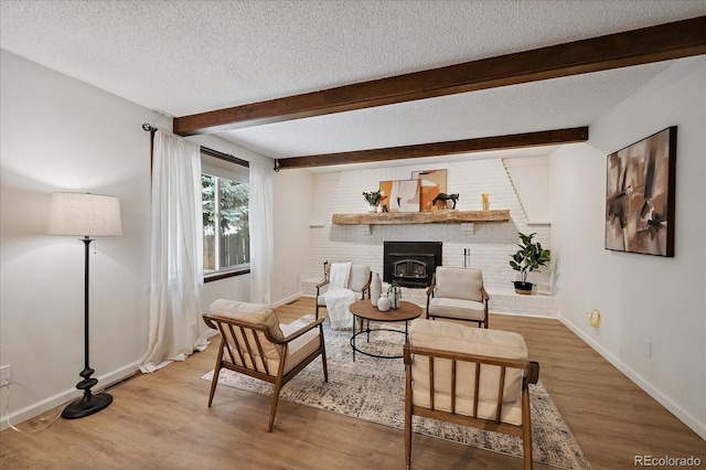 2130 Squires St, Longmont, CO 80501 - living room with wood finished floors, a textured ceiling, and beam ceiling