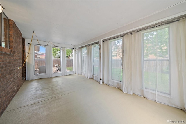 2130 Squires St, Longmont, CO 80501 - unfurnished sunroom featuring brick wall