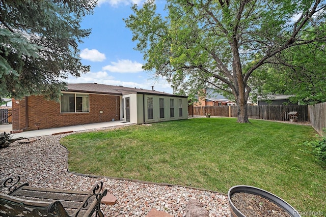 2130 Squires St, Longmont, CO 80501 - fenced backyard with a patio area