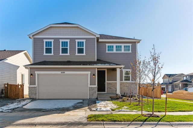 view of front facade with a garage and a front yard