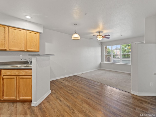 23500 E Alamo Pl Unit C, Aurora, CO 80016 - kitchen with a ceiling fan, wood finished floors, open floor plan, decorative light fixtures, and recessed lighting