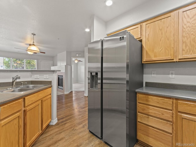 23500 E Alamo Pl Unit C, Aurora, CO 80016 - kitchen with stainless steel fridge, a ceiling fan, light wood-style flooring, dark countertops, and recessed lighting