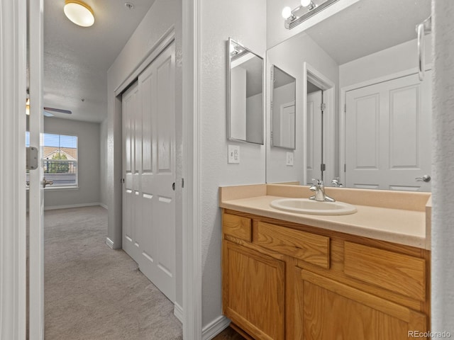 23500 E Alamo Pl Unit C, Aurora, CO 80016 - bathroom featuring vanity and a textured ceiling