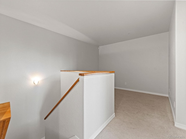 23500 E Alamo Pl Unit C, Aurora, CO 80016 - corridor with an upstairs landing and light carpet
