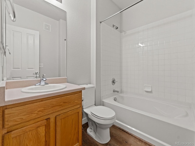 23500 E Alamo Pl Unit C, Aurora, CO 80016 - bathroom featuring vanity, washtub / shower combination, and wood finished floors