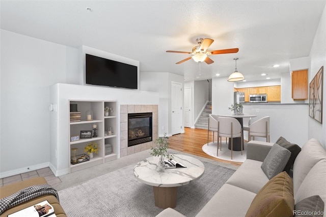 23500 E Alamo Pl Unit C, Aurora, CO 80016 - living room with stairway, a ceiling fan, a fireplace, and recessed lighting