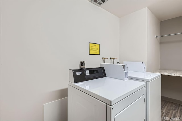 washroom featuring separate washer and dryer and hardwood / wood-style floors