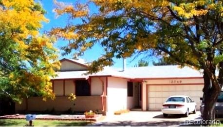 single story home with a garage