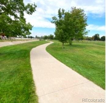 surrounding community featuring a lawn