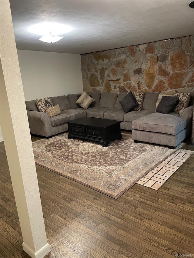 living room featuring dark wood-type flooring