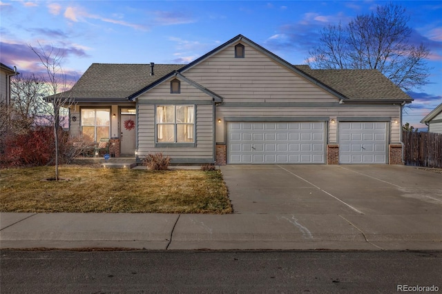 view of front facade with a garage, concrete driveway, brick siding, and a shingled roof