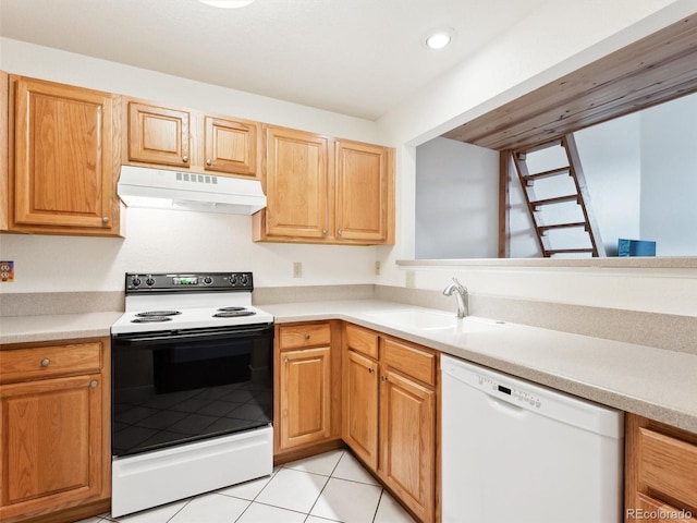 kitchen with sink, light tile patterned flooring, and white appliances