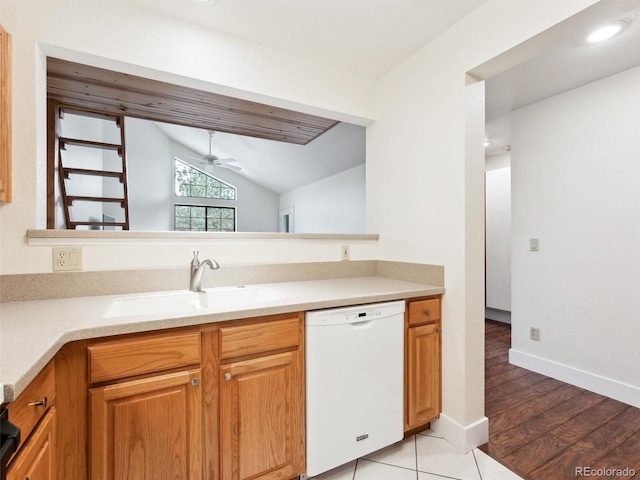 kitchen with ceiling fan, dishwasher, sink, light hardwood / wood-style floors, and lofted ceiling