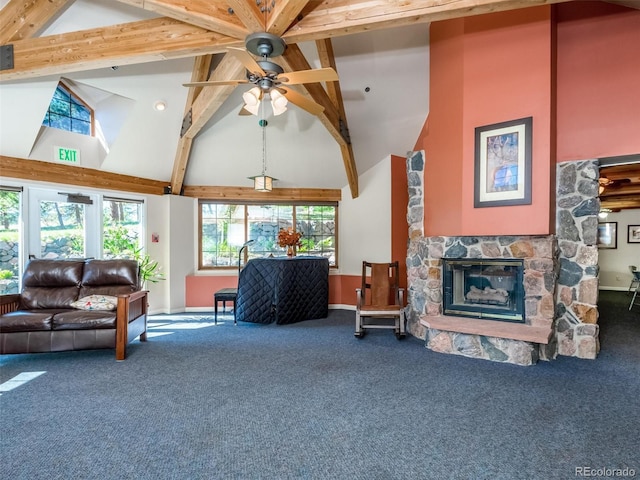 living room featuring beam ceiling, a stone fireplace, carpet floors, and high vaulted ceiling