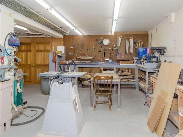 miscellaneous room featuring a workshop area