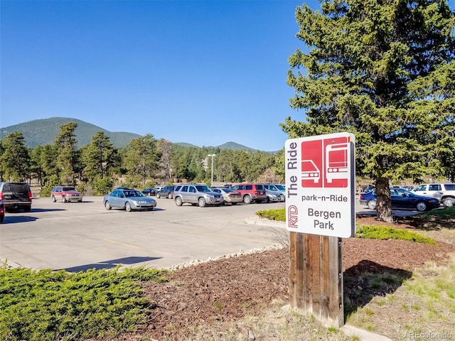 view of car parking with a mountain view