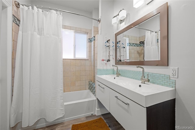 full bath featuring shower / bath combination with curtain, decorative backsplash, wood finished floors, and vanity