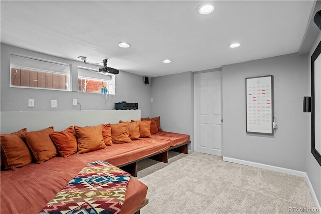 carpeted living room featuring recessed lighting and baseboards