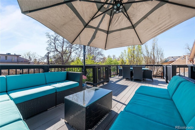 deck featuring an outdoor hangout area and outdoor dining area