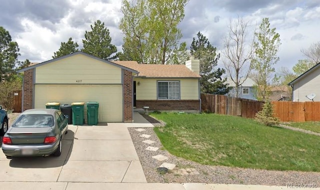 ranch-style home featuring a garage and a front yard