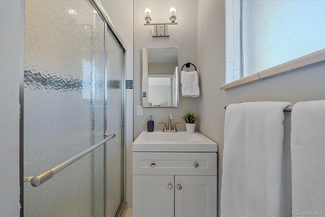 bathroom with vanity and an enclosed shower