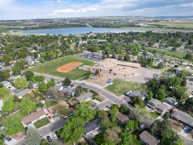7695 S Harlan St, Littleton, CO 80128 - aerial view of property's location with a nearby body of water and nearby suburban area