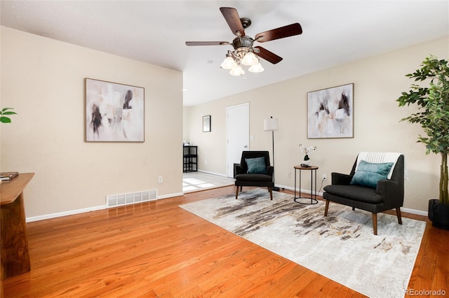 7695 S Harlan St, Littleton, CO 80128 - sitting room featuring wood finished floors, a ceiling fan, and baseboards