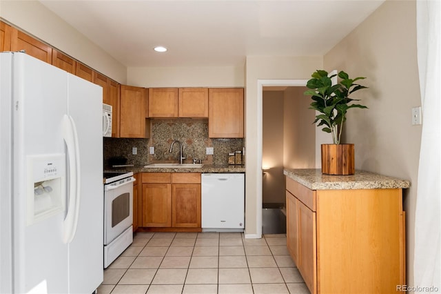 7695 S Harlan St, Littleton, CO 80128 - kitchen with white appliances, a sink, backsplash, light tile patterned flooring, and recessed lighting