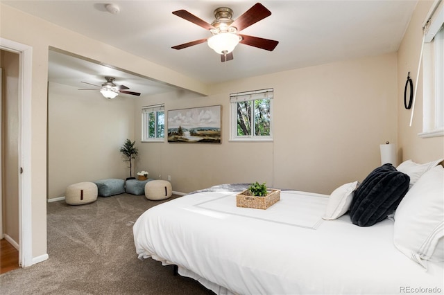 7695 S Harlan St, Littleton, CO 80128 - carpeted bedroom with baseboards and a ceiling fan