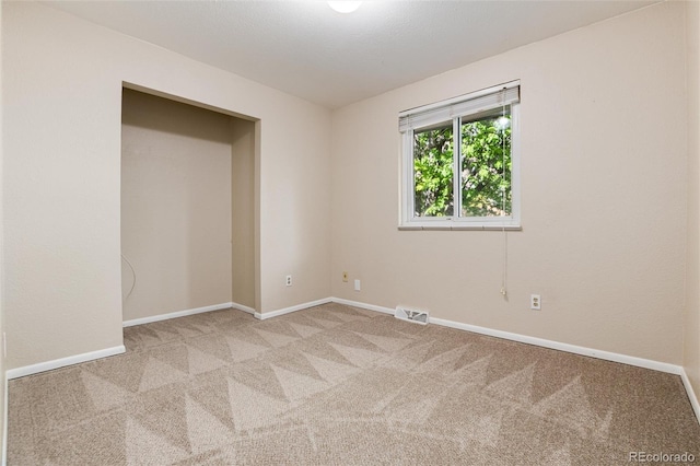 7695 S Harlan St, Littleton, CO 80128 - carpeted empty room featuring baseboards