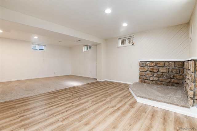 7695 S Harlan St, Littleton, CO 80128 - unfurnished living room featuring wood finished floors, baseboards, and recessed lighting