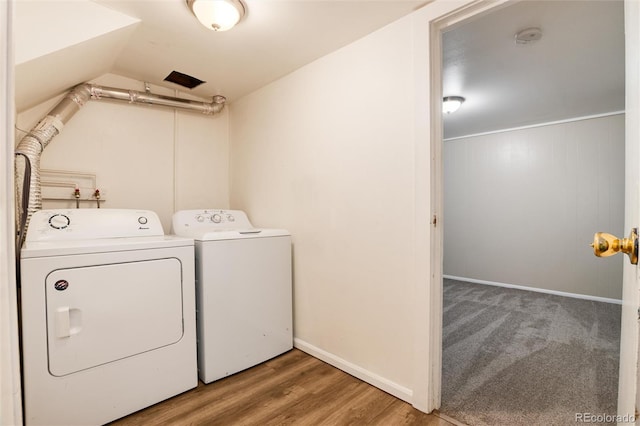 7695 S Harlan St, Littleton, CO 80128 - washroom with washer and dryer, baseboards, and wood finished floors