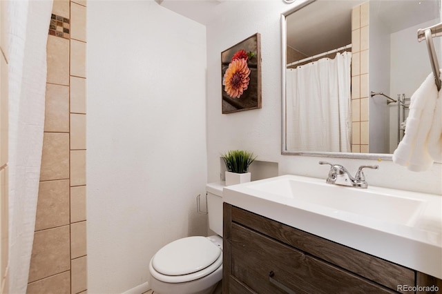 7695 S Harlan St, Littleton, CO 80128 - bathroom featuring toilet, vanity, and a shower with curtain