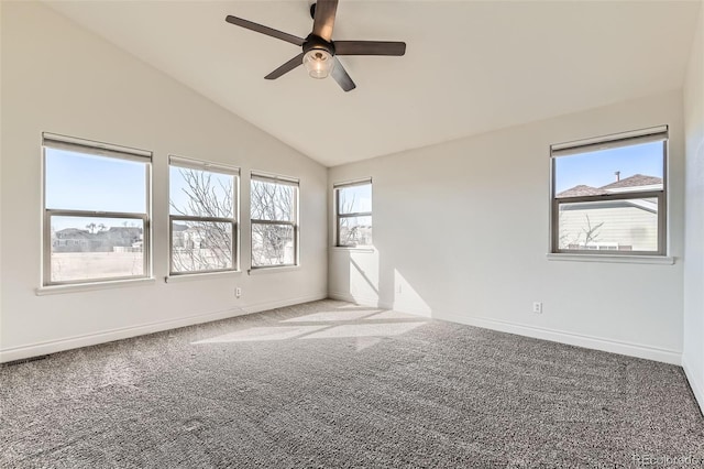 spare room with lofted ceiling, baseboards, and carpet