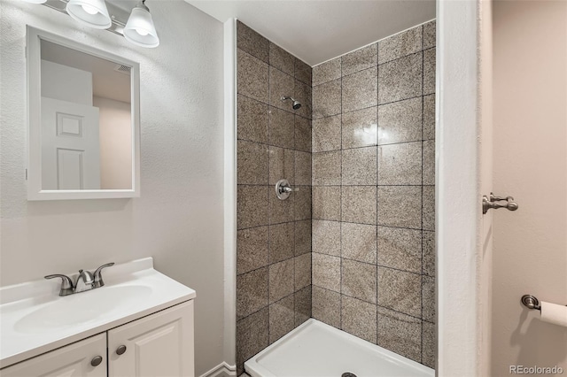 full bathroom featuring a shower stall and vanity