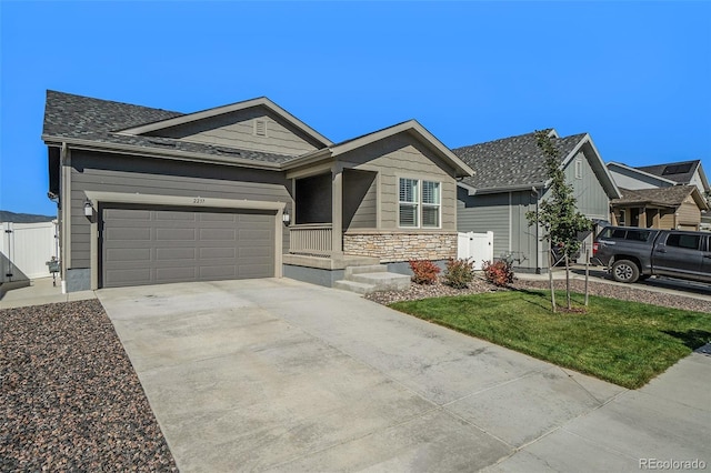 view of front of property with a front yard and a garage