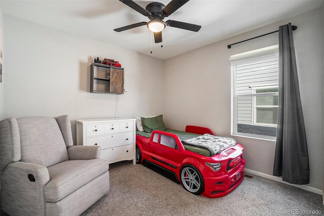 bedroom with light carpet and ceiling fan