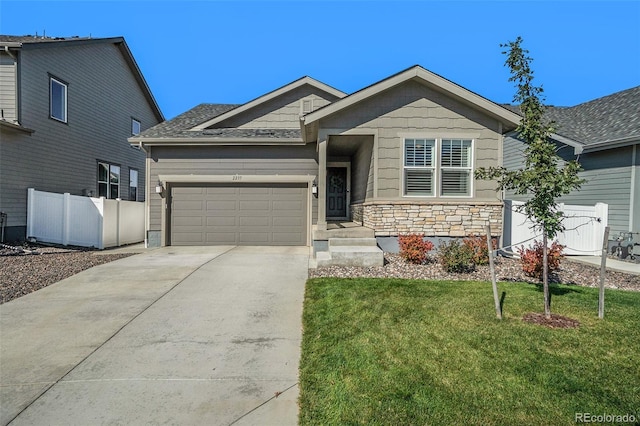 view of front facade with a front yard and a garage