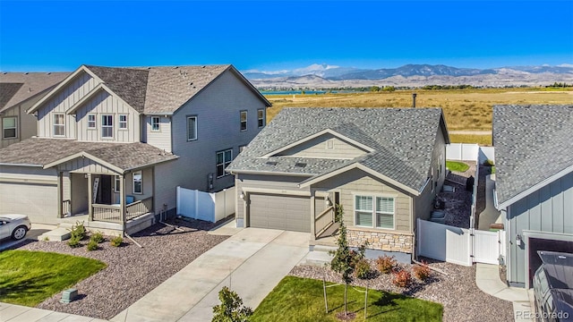 view of front of property featuring a garage and a mountain view