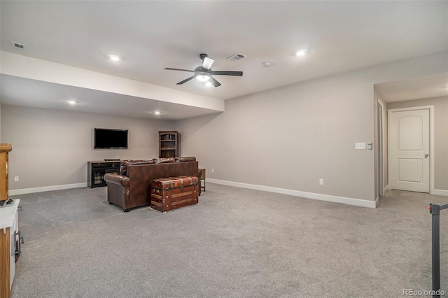 living room with light colored carpet and ceiling fan