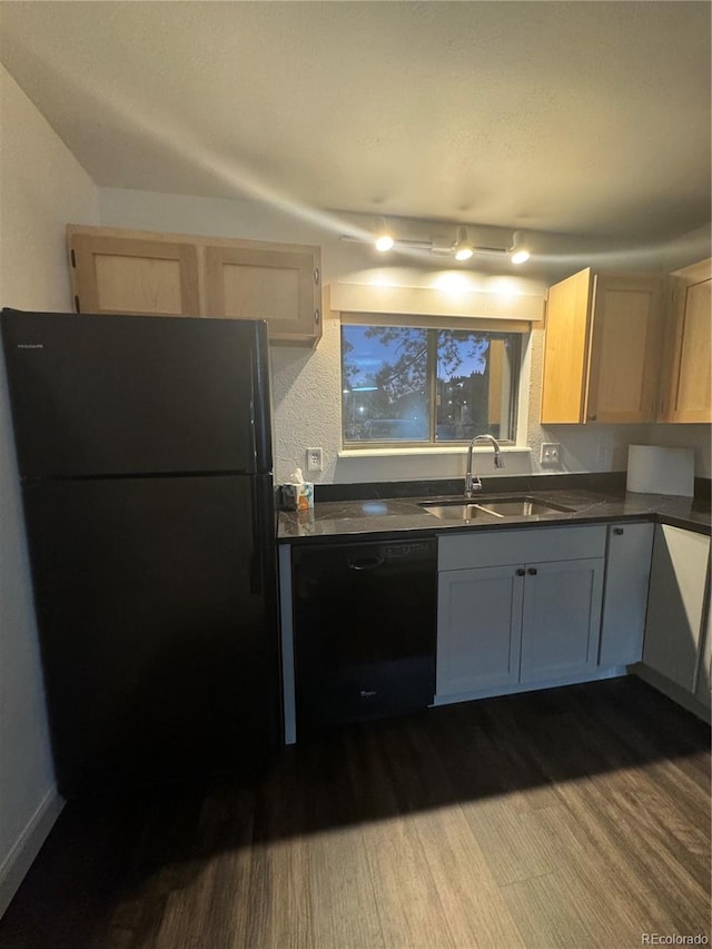 kitchen with wood-type flooring, light brown cabinets, sink, and black appliances