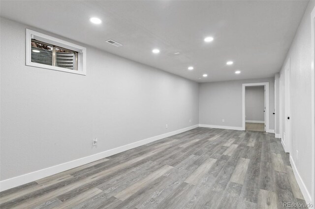 4672 S Lewiston Way, Aurora, CO 80015 - finished below grade area featuring recessed lighting, wood finished floors, and baseboards