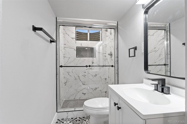 4672 S Lewiston Way, Aurora, CO 80015 - bathroom with a marble finish shower, vanity, toilet, and marble finish floors