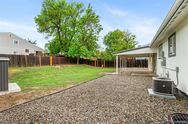 4672 S Lewiston Way, Aurora, CO 80015 - view of yard featuring central AC unit and a patio area