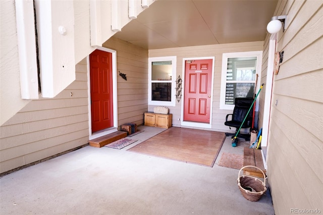 view of exterior entry with covered porch